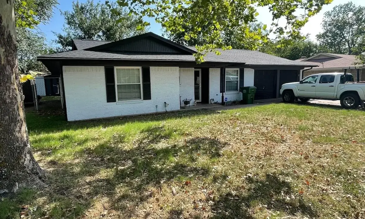 Professional roofing crew working on a residential roof in Orinda